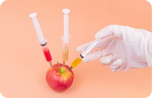 An Apple being injected with chemicals
